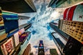 High rising skyscrapers at Times Square in NYC. The place is famous as world`s busiest place and an iconic landmark in Manhattan. Royalty Free Stock Photo