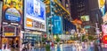 NEW YORK CITY - JUNE 13, 2013: Tourists enjoy night life in Times Square. New York attracts 50 million people from all over the Royalty Free Stock Photo