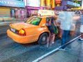 NEW YORK CITY - JUNE 16, 2013: Yellow cabs at night in Times Square. In NYC there are more than 13,000 taxis Royalty Free Stock Photo