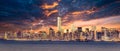 New York City Manhattan downtown skyline at dusk with skyscrapers illuminated over Hudson River panorama. Dramatic Royalty Free Stock Photo
