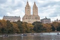 New York City, Manhattan. People rowing on boats in Central Park. Moody Autumn Lake Tourism