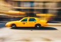 New York City - March 20, 2017 : Yellow taxi cab speeds down in a New York City Street. Shot with long shutter speed for Royalty Free Stock Photo