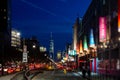 New York City night street scene at Chelsea Pier with blurred lights of the buildings and cars Royalty Free Stock Photo