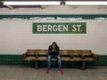 Commuters waiting at the Bergen Street Subway Station in Brooklyn, New York along the F line