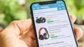 Man searching Headphones on Amazon app with Mobile Smart iPhone