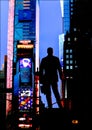 George M. Cohan statue in lighted Times Square at night