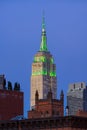 The Empire State Building at twilight illuminated in green light. New York City Royalty Free Stock Photo