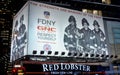 Firefighters sign at Times Square,