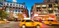 NEW YORK CITY - OCTOBER 23, 2015: Yellow cabs move fast in Herald Square Royalty Free Stock Photo