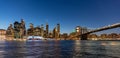 New York City's Brooklyn Bridge and Manhattan skyline illuminated at night Royalty Free Stock Photo
