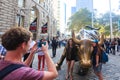 NEW YORK CITY - SEP 16: Charging Bull sculpture and tourists on Royalty Free Stock Photo