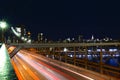 New York City skyline, Brooklyn Bridge traffic at night, Manhattan buildings and skyscrapers Royalty Free Stock Photo