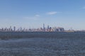 The New York City Skyline in the Distance seen from St. George on Staten Island along New York Harbor Royalty Free Stock Photo