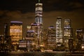 New York city skyline with illuminated buildings in the blue evening hour Royalty Free Stock Photo