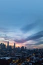 New York City skyline lights at dusk with empty blue sky above the buildings of Lower Manhattan Royalty Free Stock Photo