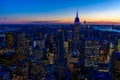 New York City skyline at night - skyscrapers of midtown Manhattan with Empire State Building at Amazing Sunset - USA