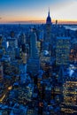 New York City skyline at night - skyscrapers of midtown Manhattan with Empire State Building at Amazing Sunset - USA Royalty Free Stock Photo