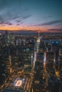 New York city skyline at sunset with the lights shining bright Royalty Free Stock Photo