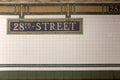 New York City Station subway 28th Street sign on tile wall. Royalty Free Stock Photo