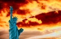 New York City, The Statue of Liberty in a colorful sunset Royalty Free Stock Photo