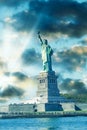 New York City, The Statue of Liberty at sunset with a beautiful colorful sky Royalty Free Stock Photo