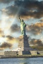 New York City, The Statue of Liberty at sunset with a beautiful colorful sky Royalty Free Stock Photo