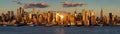 New York City sunset on Midtown and its skyscrapers. Panoramic view on Manhattan and the Hudson River banks Royalty Free Stock Photo