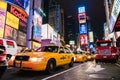 New york city taxi cab on busy Times Square street at night Royalty Free Stock Photo