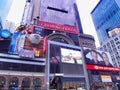 New York City Times Square on a sunny winter day, the Crowne Plazza Hotel and Hersheys store. Royalty Free Stock Photo