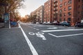 New York City Uptown street with residential building and bicycle road Royalty Free Stock Photo