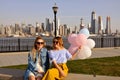 New York city urban women enjoying view of downtown Manhattan skyline, summer travel in USA