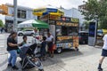 Food trucks on a street in Harlem, New York City, USA