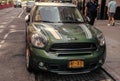 New York City, USA - August 05, 2023: 2016 MINI Cooper Countryman S green car front view, parked on the left side of Royalty Free Stock Photo