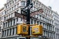 Street signs and traffic lights with stickers in SOHO New York City Royalty Free Stock Photo