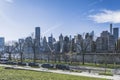 New York City, USA - February 20, 2022: New York City skyline from Roosevelt island over the East river. Cranes on the river.