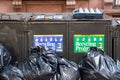 New York City, USA - July 1, 2019: old rusty recycling program trash containers