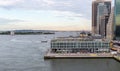 New York City / USA - JUN 20 2018: East river with pier and Governors Island at early morning in New York City