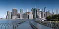 New York City / USA - JUN 25 2018: Lower Manhattan skyline at sunrise view from Brooklyn Bridge Park