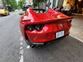 New York City, USA - June 03, 2023: Ferrari 812 GTS Superfast convertible red car lateral rear view, parked