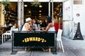 People sitting on traditional sidewalk cafe in New York Royalty Free Stock Photo