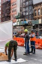 Three workers working on construction site in New York