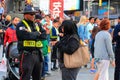 New York City, USA - June 7, 2017: Times Square Alliance Public Safety Officer attending to a tourist Royalty Free Stock Photo