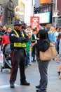 New York City, USA - June 7, 2017: Times Square Alliance Public Safety Officer attending to a tourist Royalty Free Stock Photo