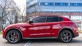 New York City, USA - March 31, 2024: 2024 Alfa Romeo Stelvio Veloce luxury red car parked outdoor, side view Royalty Free Stock Photo