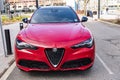 New York City, USA - March 31, 2024: 2024 Alfa Romeo Stelvio Veloce luxury red car parked outdoor, top view Royalty Free Stock Photo