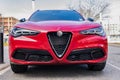 New York City, USA - March 31, 2024: 2024 Alfa Romeo Stelvio Veloce luxury red car parked outside, front view Royalty Free Stock Photo
