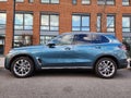 New York City, USA - March 18, 2024: BMW X5 luxury car parked outside, side view