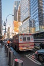 New York City, USA - March 17, 2017: FDNY Ambulance flashing lights siren blasting speed through midtown rush hour traffic in