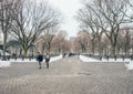 New York City, USA - March 18, 2017: People stroll and joggers run on the Mall in Central Park. Central Park is the most visited