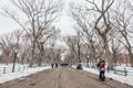 New York City, USA - March 18, 2017: People stroll and joggers run on the Mall in Central Park. Central Park is the most visited